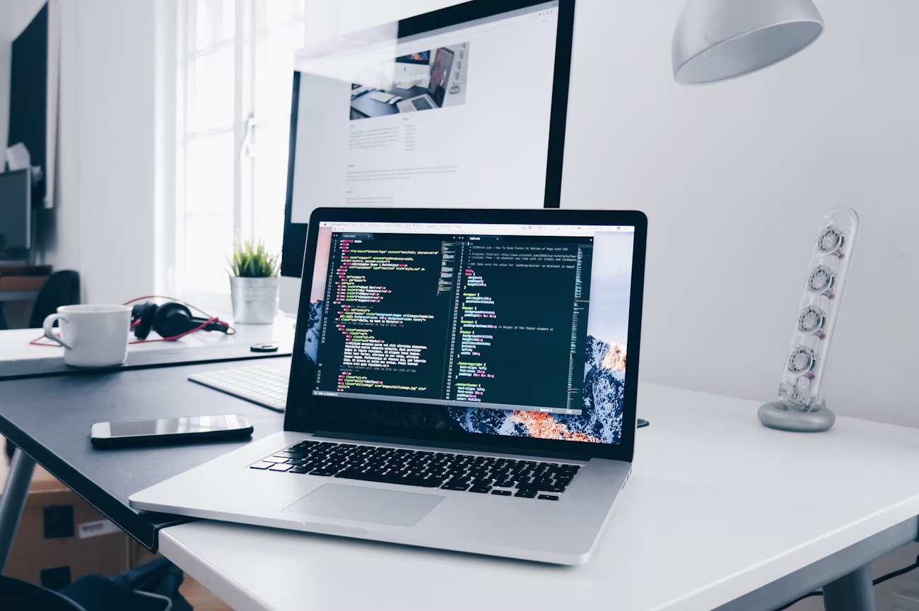 Developer workspace with computers and software tools